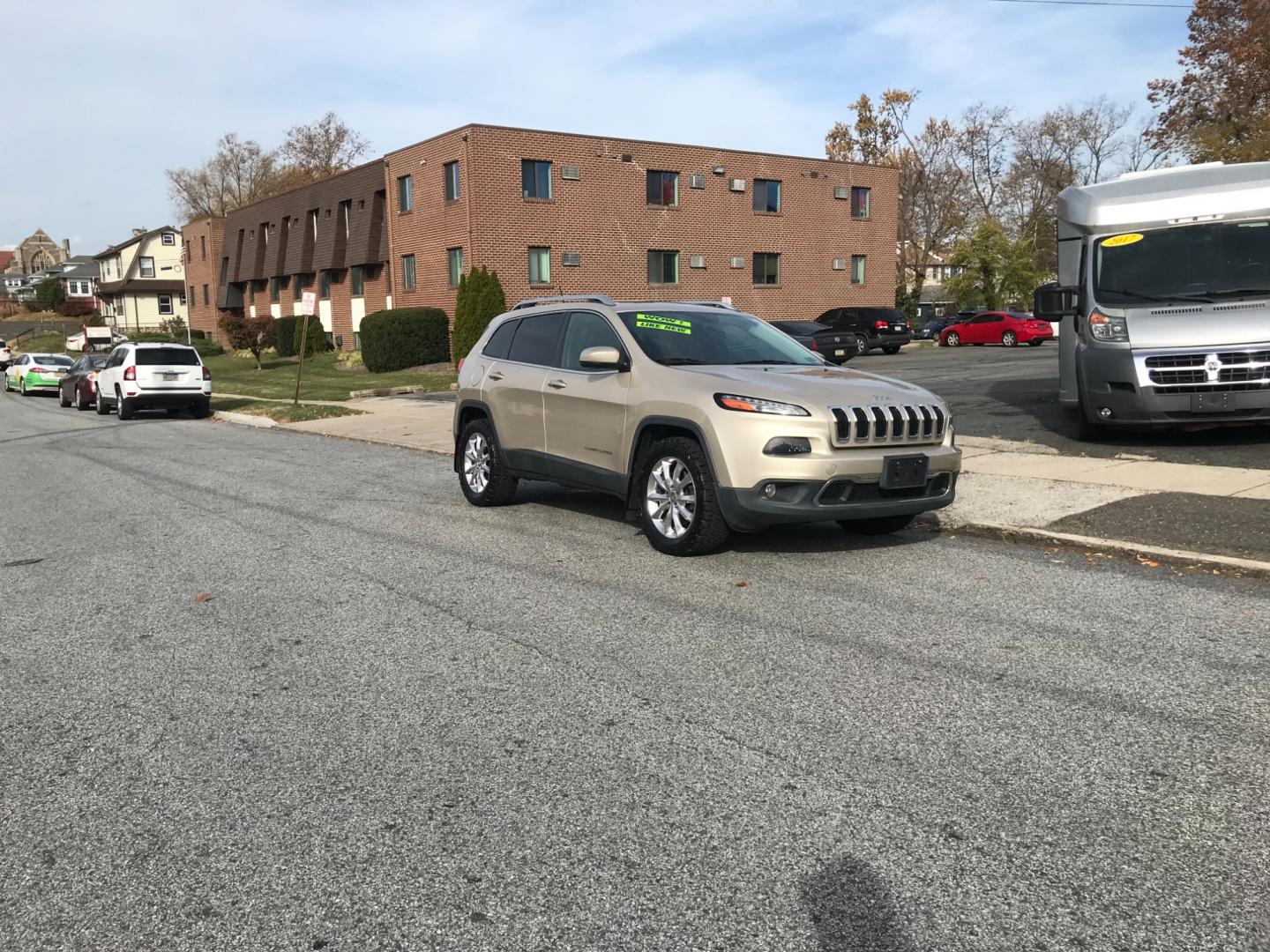 2015 Gold /Black Jeep Cherokee Limited (1C4PJMDS5FW) with an 3.2 V6 engine, Automatic transmission, located at 577 Chester Pike, Prospect Park, PA, 19076, (610) 237-1015, 39.886154, -75.302338 - Photo#1